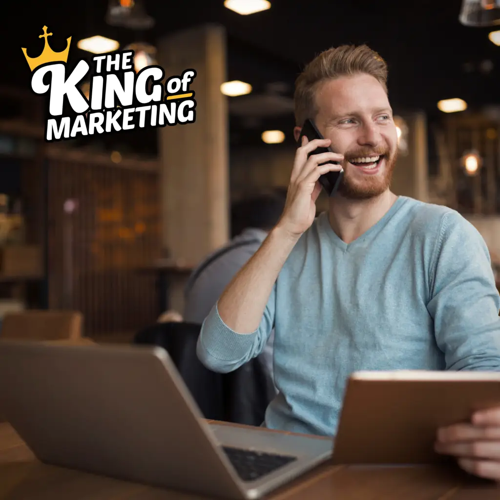 A happy The King of Marketing customer taking a phone call from receiving a new lead