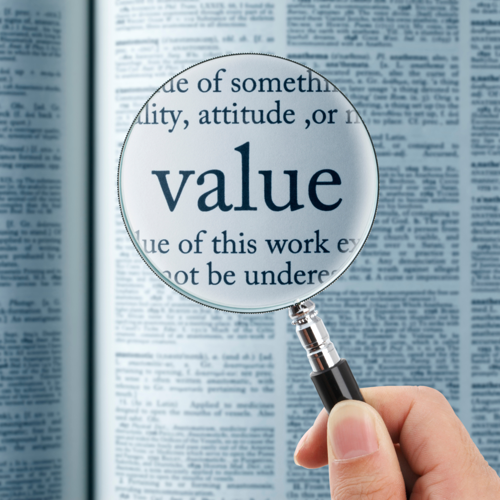 The King of Marketing - magnified glass looking over the word value in a dictionary.